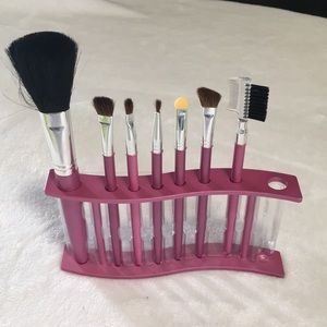 Makeup brushes set in holder. Eyeshadow, eyebrow, cheeks. Set of seven.